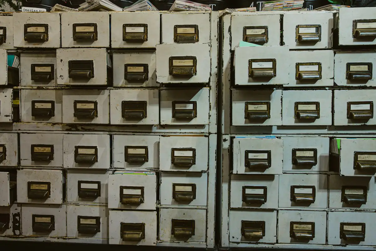 Rows of old filing cabinets with labels