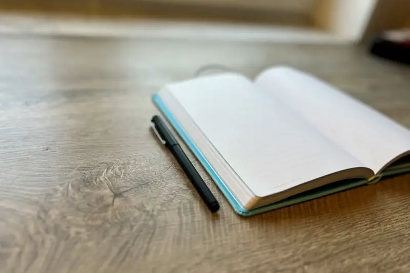 Pen resting on an open book